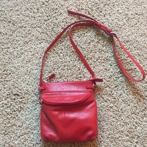 Crossbody red leather bag.